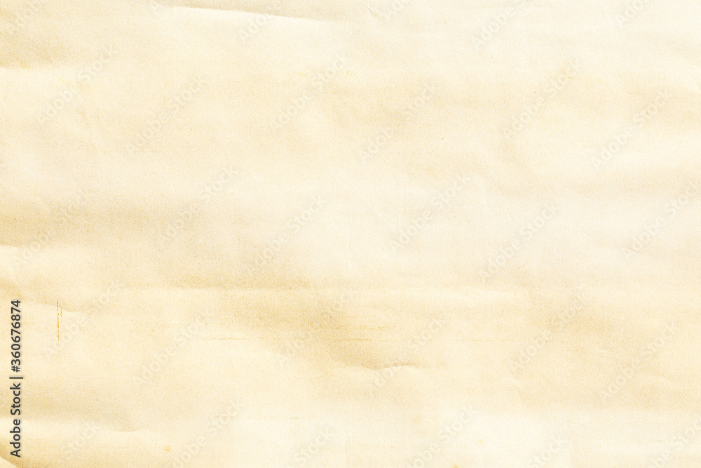 Obraz premium Pale bleached brown background paper sheet