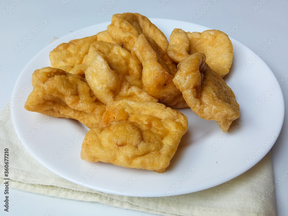 Flat and square version of Tahu Pong, or hollow tofu. Mostly used for Tahu Petis, a snack from Semarang Indonesia. Isolated in white background Flat and square version of Tahu Pong, or hollow tofu. Mostly used for Tahu Petis, a snack from Semarang Indonesia. Isolated in white background