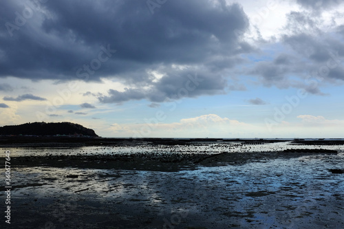 The sea view without water and the clouds are raining