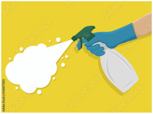 Hand with hand sprayer spraying cleaning disinfecting on yellow background.