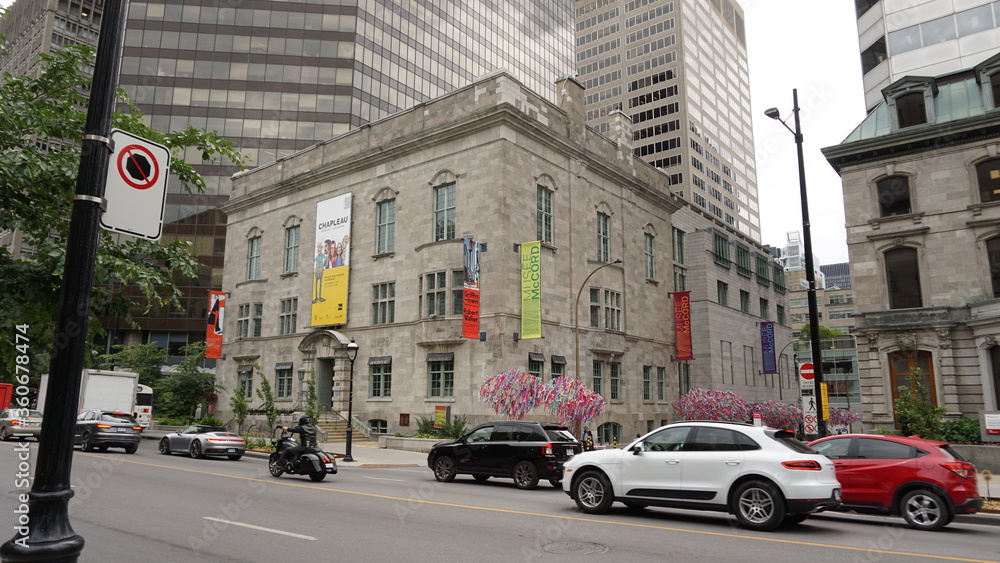 Montreal, QC/Canada - 6/26/2020: a combination of old and modern architecture at the same scene, the historical building of McCord museum with a background of a modern building of McGill univeristy.