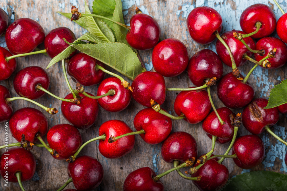 Creative fresh cherry pattern background with copy space. Top view. Creative fresh cherry pattern background with copy space. Top view.