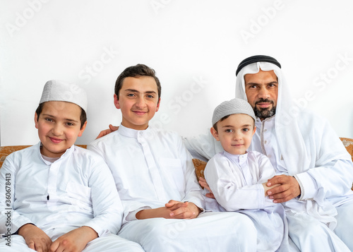 happy arabic family sitting together, photo