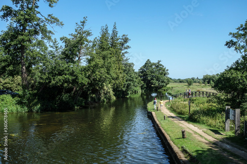 Walkers beside The River Wey Near Triggs Lock Guildford Surrey