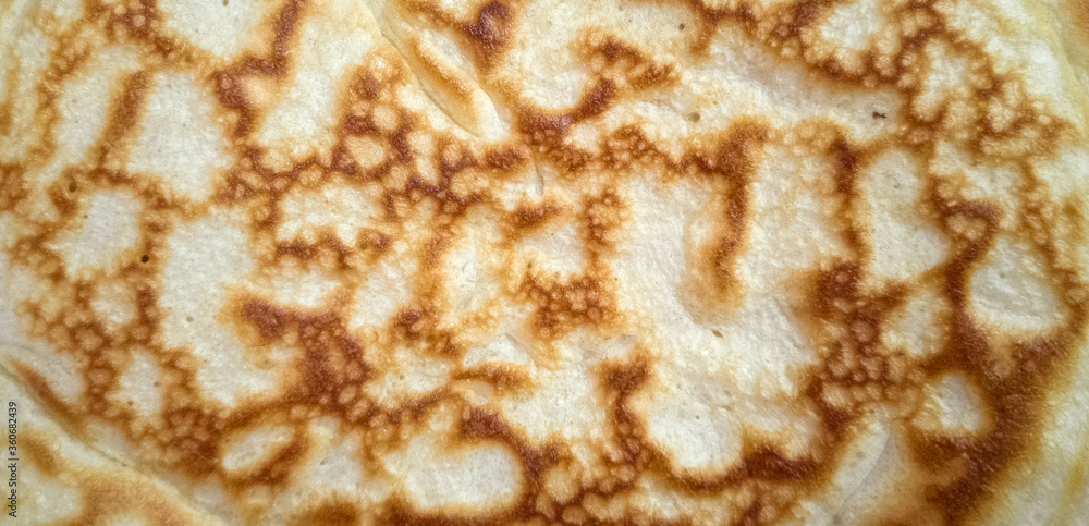 Close-up pancake surface. Beautiful background. Copy space. Close-up pancake surface. Beautiful background. Copy space.