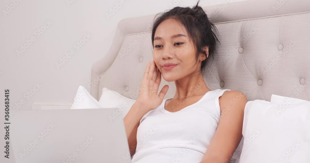 Portrait of beautiful asian woman using laptop to video call to her friend or family. Portrait of beautiful asian woman using laptop to video call to her friend or family.