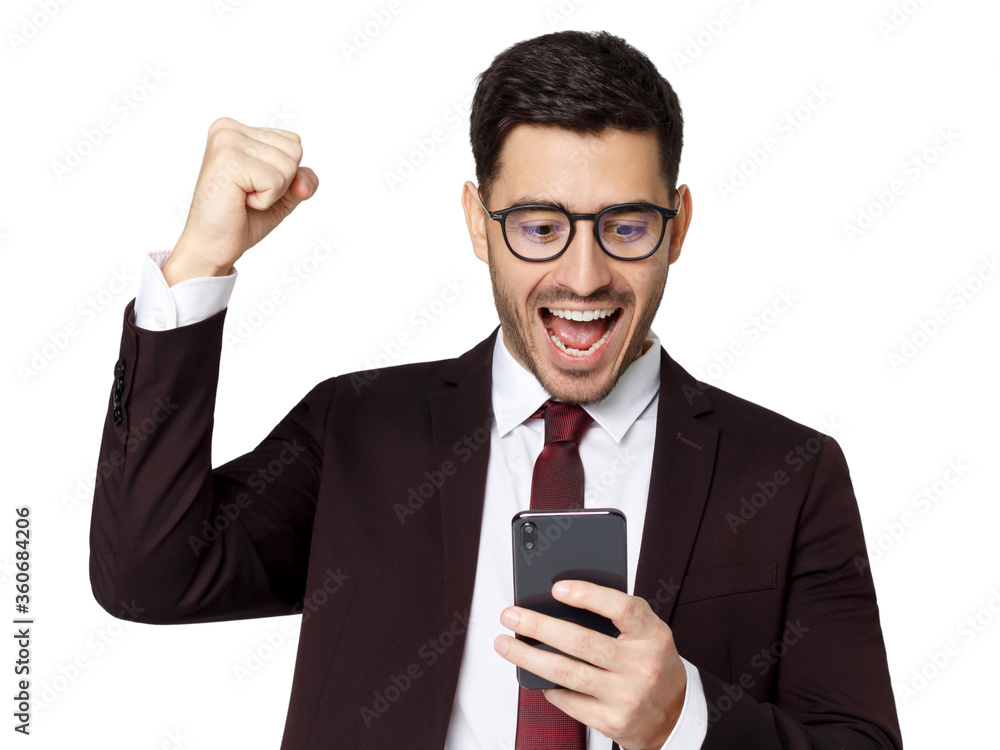 Portrait of excited young business man looking at smartphone, isolated on white background. Winner concept Portrait of excited young business man looking at smartphone, isolated on white background. Winner concept