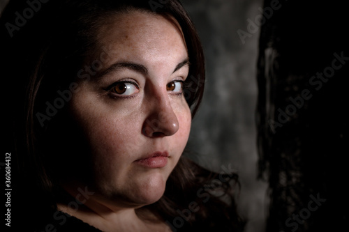 Canvastavla Vintage photo style image of Plus size BBW brunette woman posing in a low key