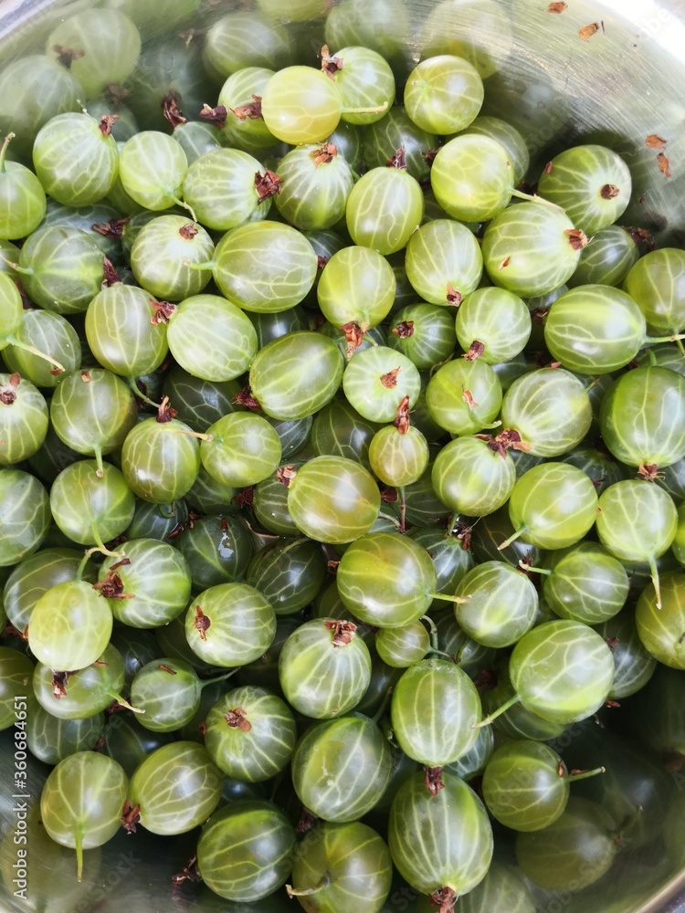 Gooseberries in bowl close-up directly above Gooseberries in bowl close-up directly above