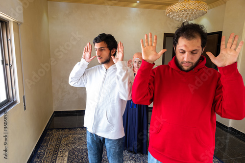 Muslim family memebers praying dohor togther photo