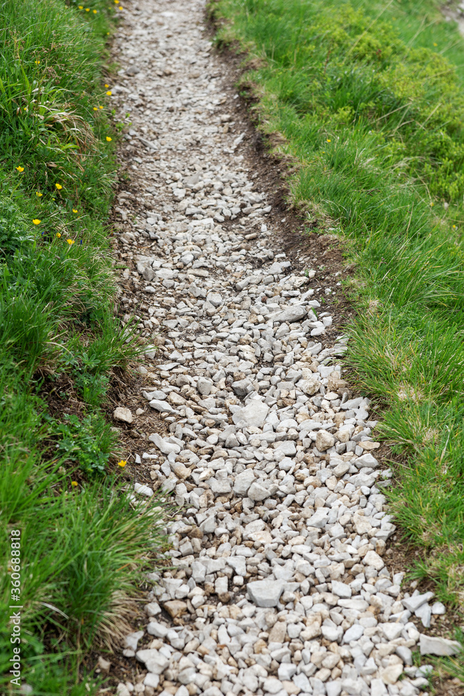 Closeup of path for pedestrians with bright small pebbles Closeup of path for pedestrians with bright small pebbles