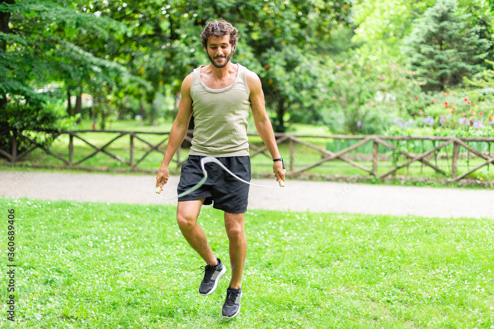 Man jumping a rope outdoors