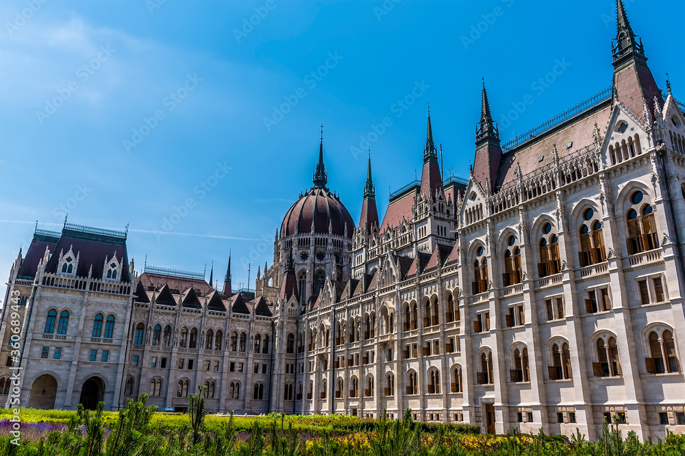The domes and spires of the Hungarian Parliament building in Budapest during summertime