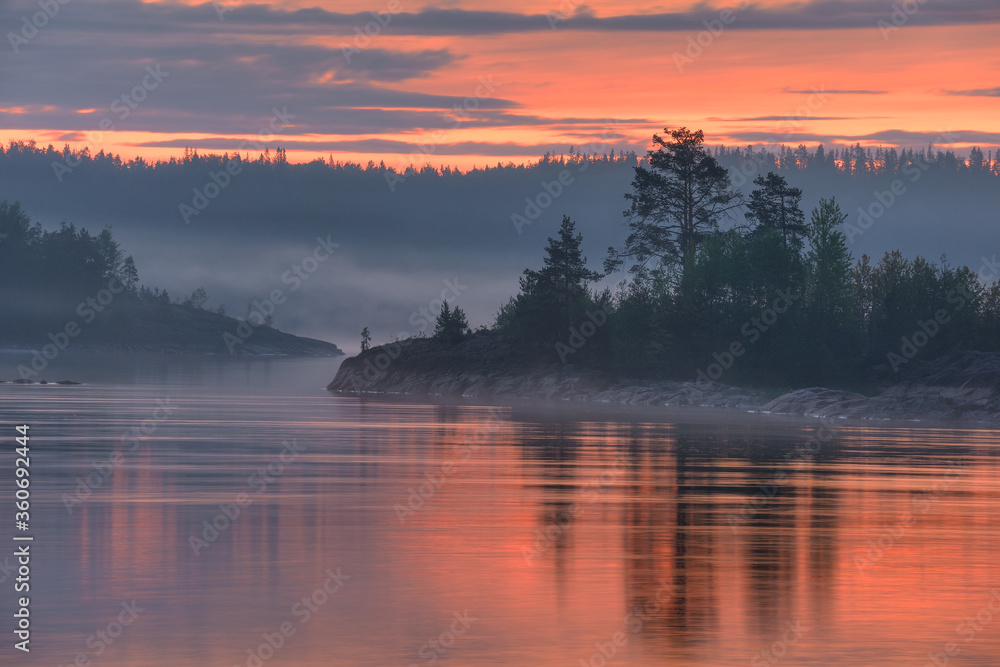 Foggy morning on lake Islands, lake Ladoga, Republic of Karelia, Russia Foggy morning on lake Islands, lake Ladoga, Republic of Karelia, Russia