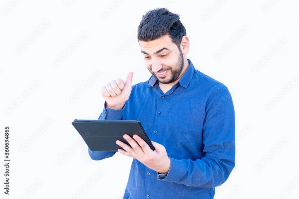 Arabic guy talking online on his tablet Arabic guy talking online on his tablet