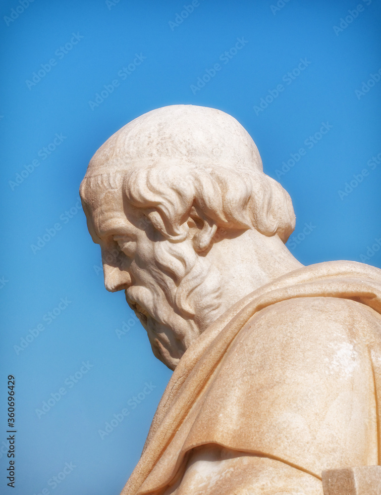 Plato the ancient Greek philosopher white marble statue profile portrait detail on sky background, Athens Greece
