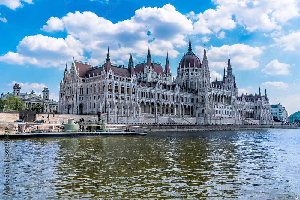Fototapeta premium A view of the Parliament Building in Budapest from a boat on the River Danube during summertime