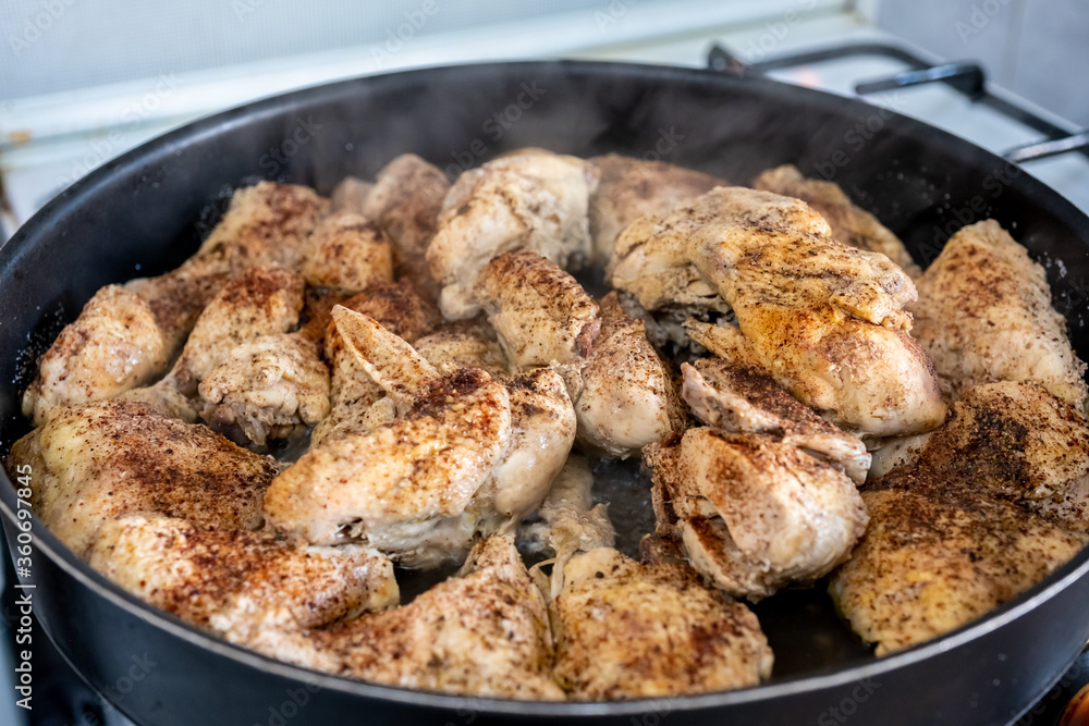 Tray filled with chicken to go to oven Tray filled with chicken to go to oven
