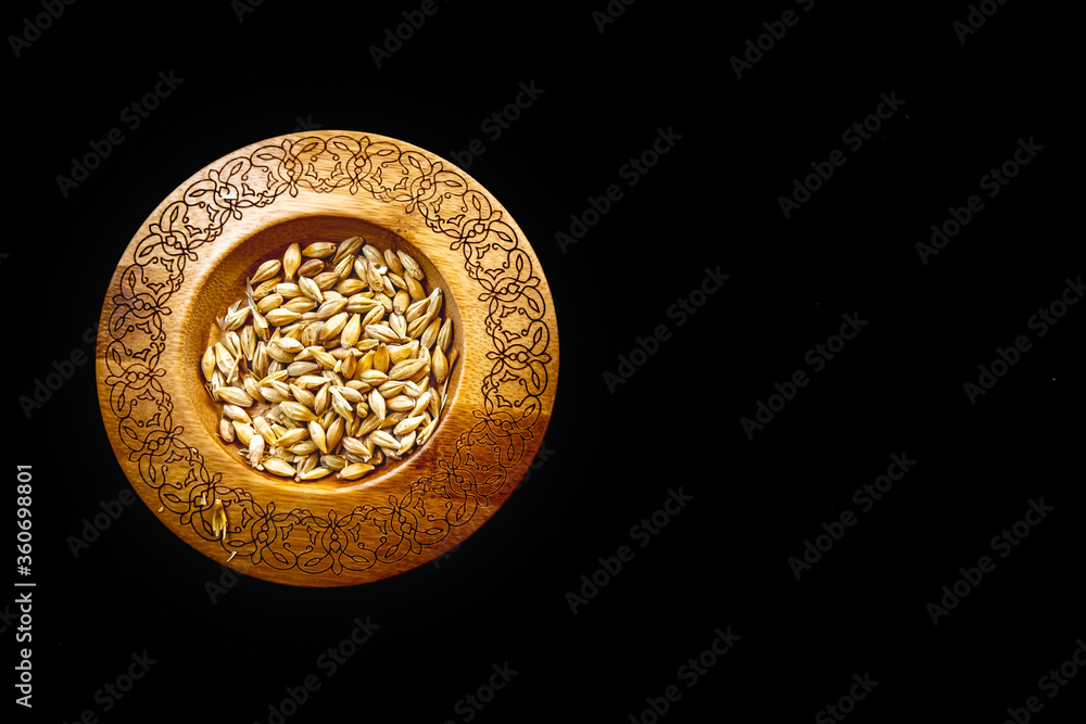 Wheat seed on table with black background Wheat seed on table with black background