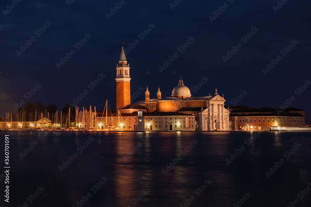 Church of San Giorgio Maggiore at night with city lights, Venice