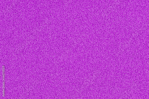 A macro photo of a purple gradient color with texture from real foam sponge paper for background, backdrop or design.