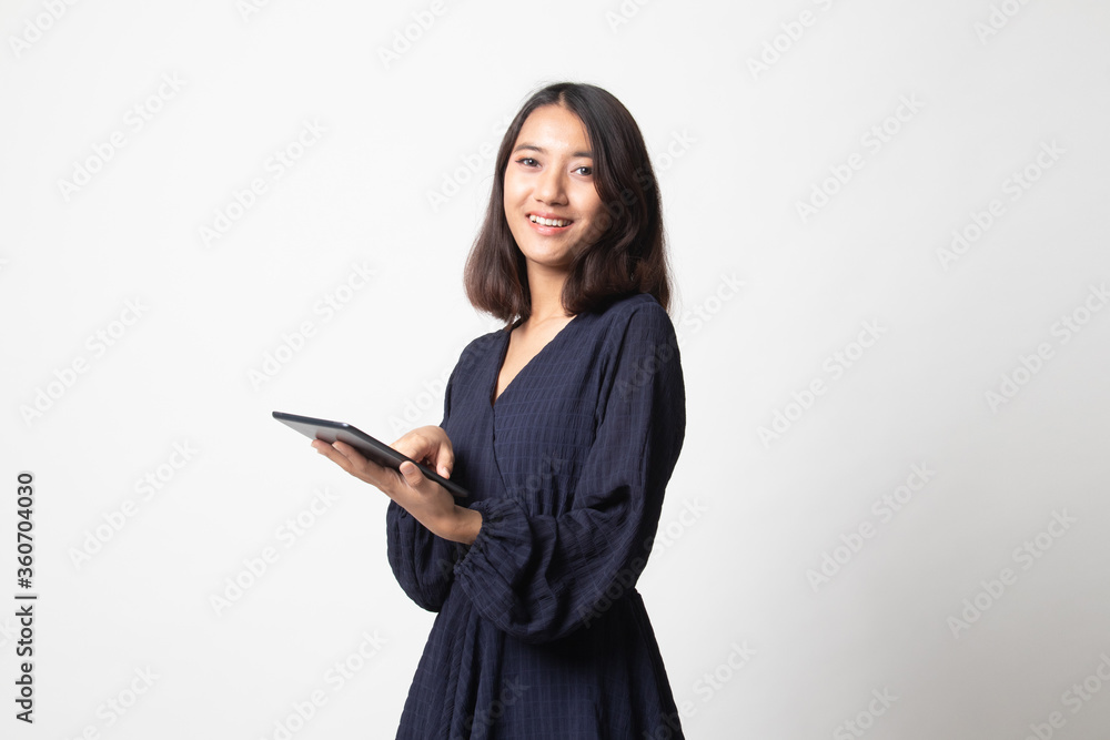 Young Asian woman with a computer tablet. Young Asian woman with a computer tablet.