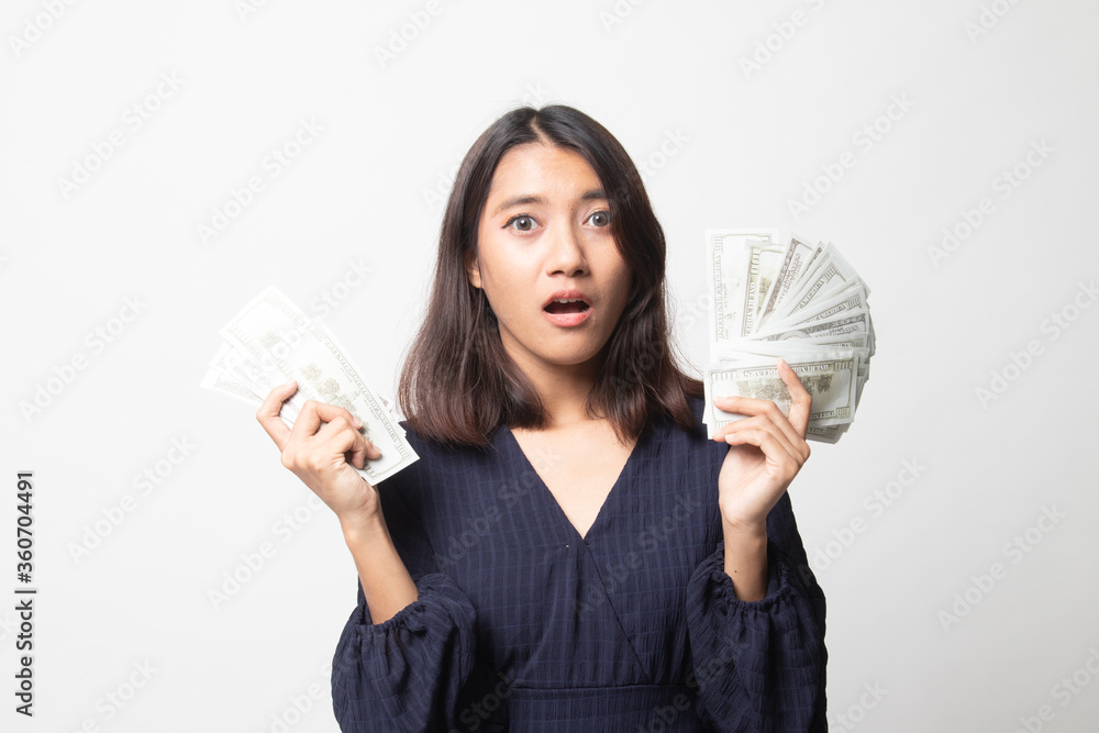 Portrait of young asian woman showing bunch of money banknotes. Portrait of young asian woman showing bunch of money banknotes.