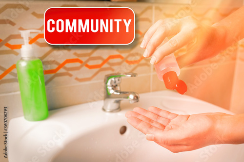 Conceptual hand writing showing Community. Concept meaning group of showing with a common characteristics living together Handwashing procedures for minimizing bacterial growth photo