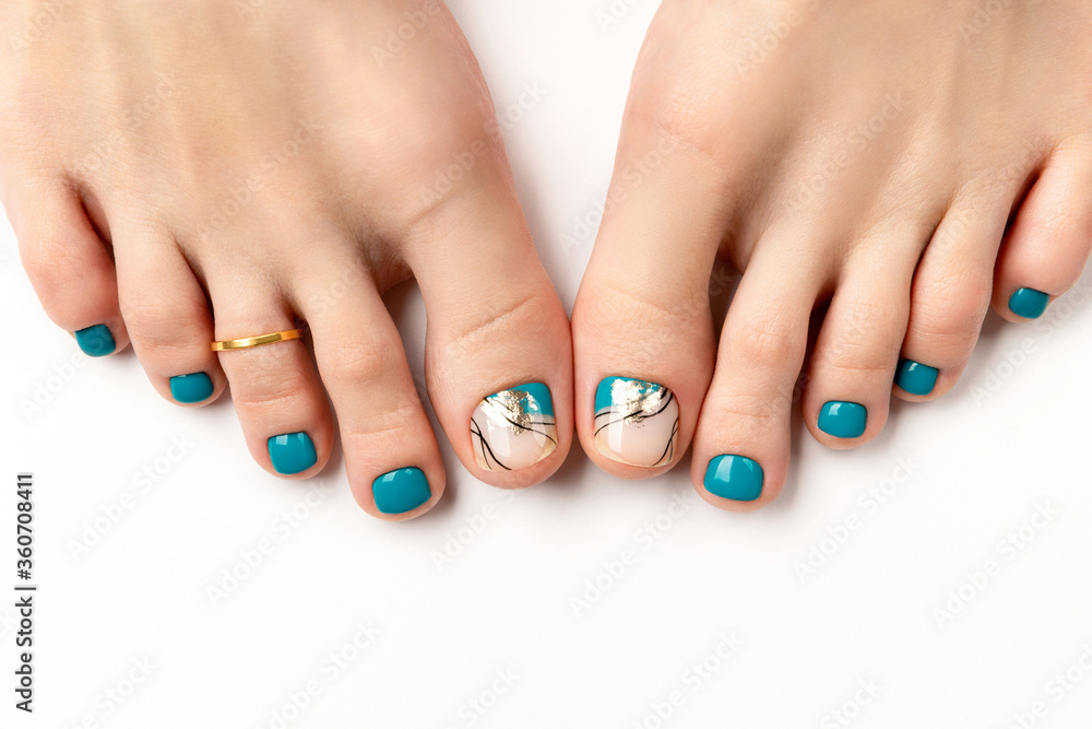 Manicure, pedicure beauty salon concept. Womans feet on white background Manicure, pedicure beauty salon concept. Womans feet on white background