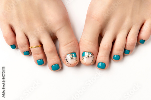 Manicure, pedicure beauty salon concept. Womans feet on white background photo