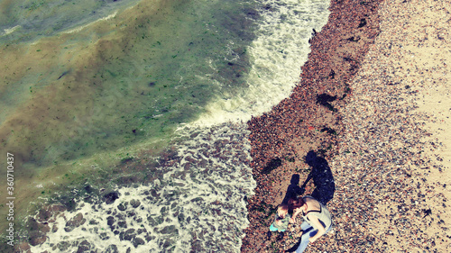 Cuadro en lienzo Toddler with Nan on Beach walk near Beltinge on the Kent Coast.