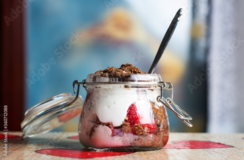 Strawberry parfait dessert in a glass jar