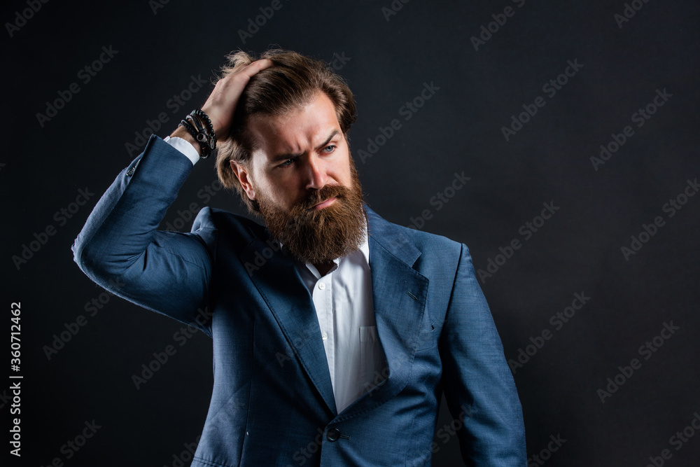 formal fashion model. handsome man on gray background. serious bearded businessman. stylish mature man looking modern. mens office wardrobe. fashionable man dressed in suit
