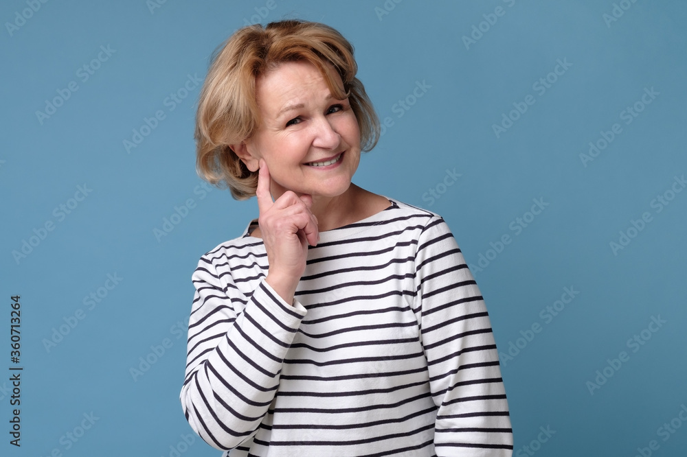 Happy confident old senior woman smiling looking at camera. Positive facial human emotion. Happy confident old senior woman smiling looking at camera. Positive facial human emotion.