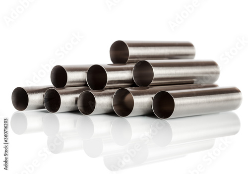 Stack of metal pipes. Chrome steel tubes isolated on white background