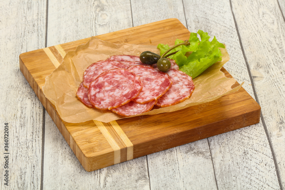 Spanish Salchichon sausage with salad Spanish Salchichon sausage with salad