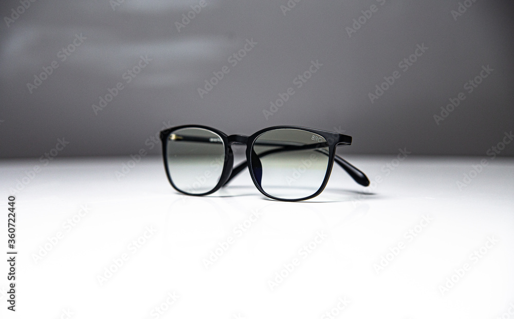 black-rimmed glasses isolated on white - gray background