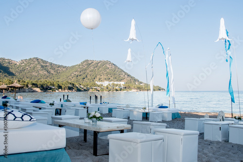 Beachfront wedding party decoration with blue sky