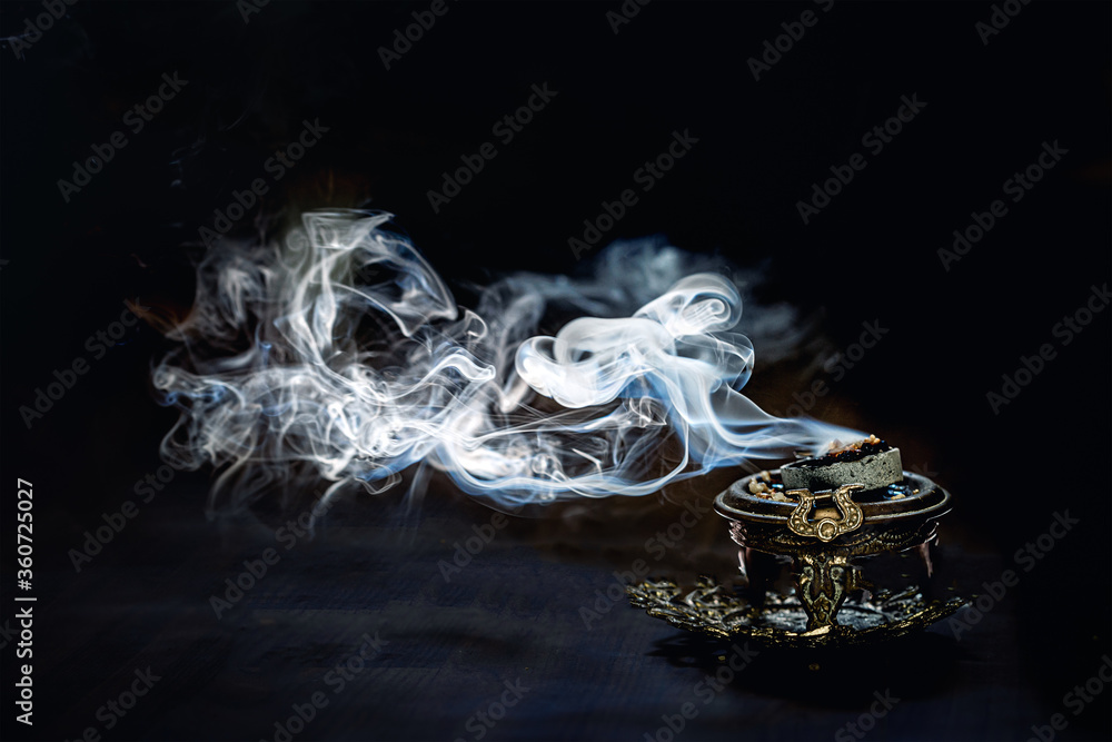 decorated incense with burning carbon and resins. decorated incense with burning carbon and resins.