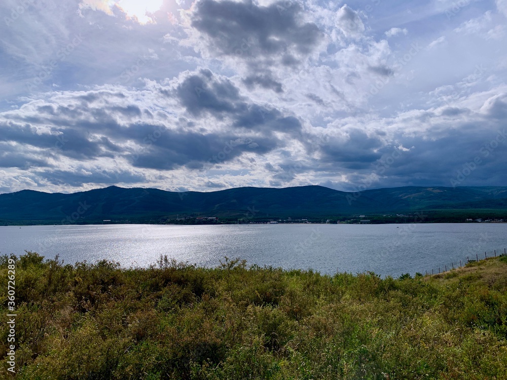 Dramatic sky. Sunset. Panoramic view. A group of clouds in the sky Dramatic sky. Sunset. Panoramic view. A group of clouds in the sky