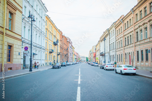 Ancient streets and embankment with the Neva River in the city of Saint Petersburg © travnikovstudio