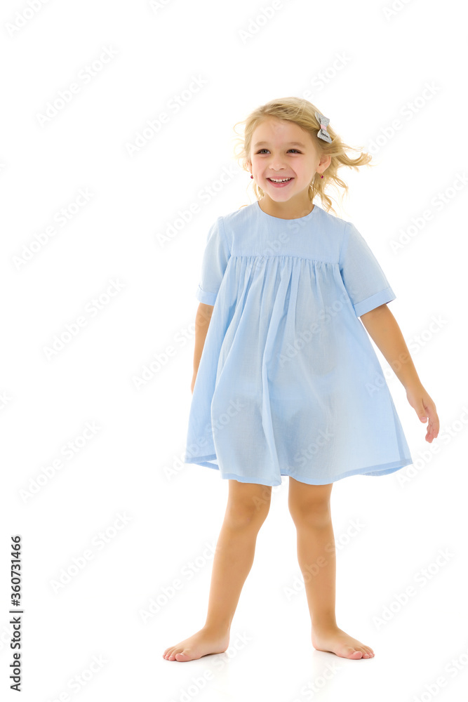 Little girl in an elegant dress.The concept of a happy childhood, healthy lifestyle. Little girl in an elegant dress.The concept of a happy childhood, healthy lifestyle.