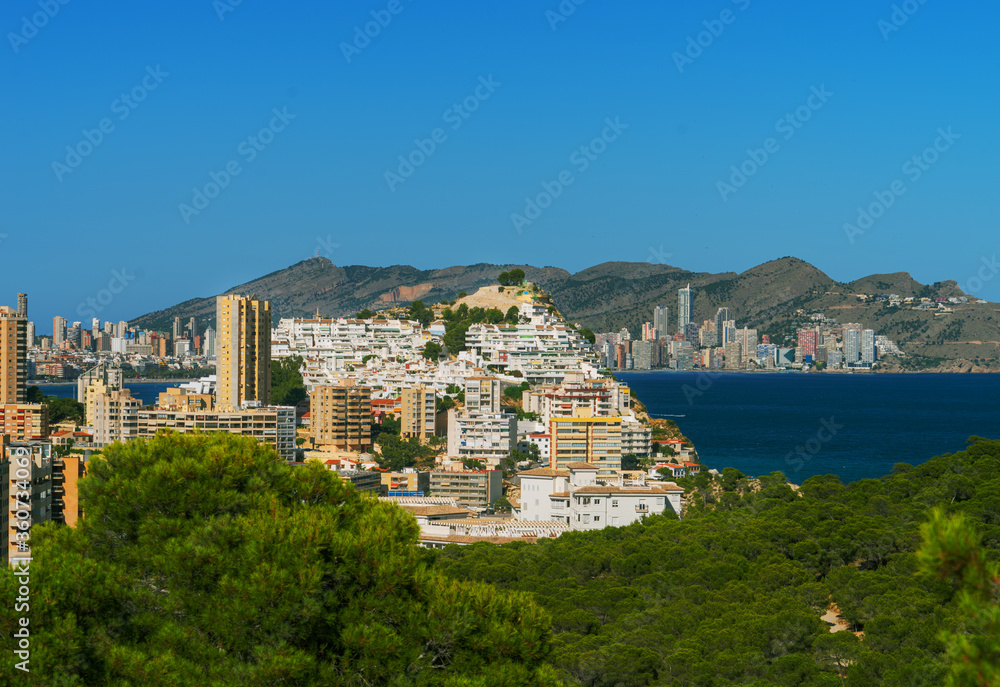 Panorama of the Benidorm city resort and Tossal de la cala from a hill of a natural park in Villajoyosa. Costa Blanca. Spain