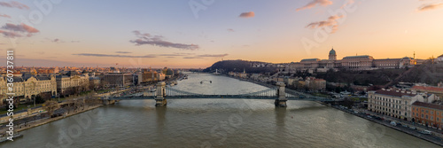 Aerial Panoramic drone shot of chain bridge over Danube river during Budapest sunset time photo