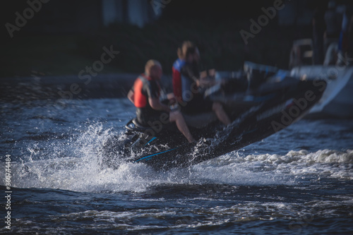 View of jet ski in motion, group of jet skiers with a big water splash