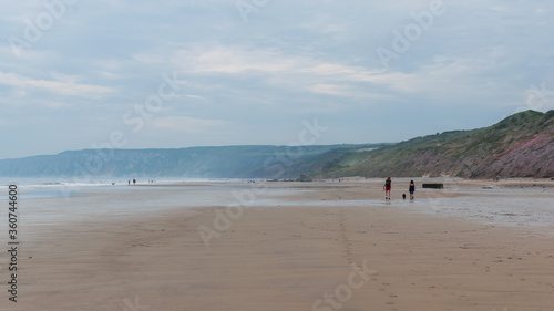 people walking on the beach © Steven Clough