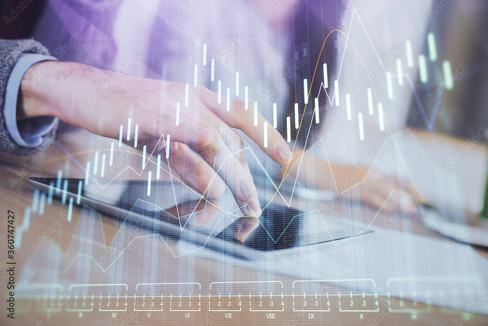 Double exposure of forex graph drawing and man and woman working together holding and using a mobile device. Trade concept. Double exposure of forex graph drawing and man and woman working together holding and using a mobile device. Trade concept.