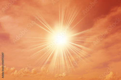 Hot summer sun on a yellow background with copyspace