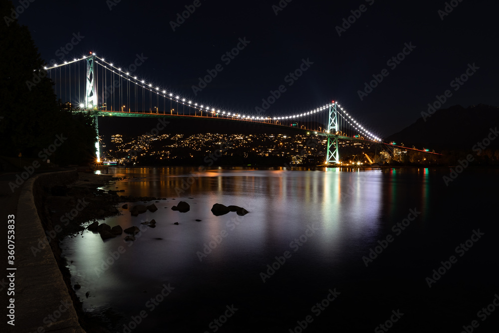 Fototapeta premium View of Lions Gate Bridge in Vancouver Canada at night from Stanley Park