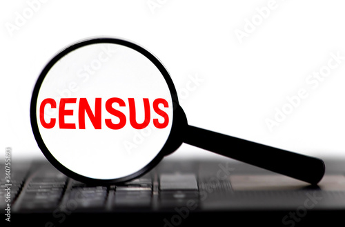 Census word on memo note throught the loupe magnifier © Uladzislau